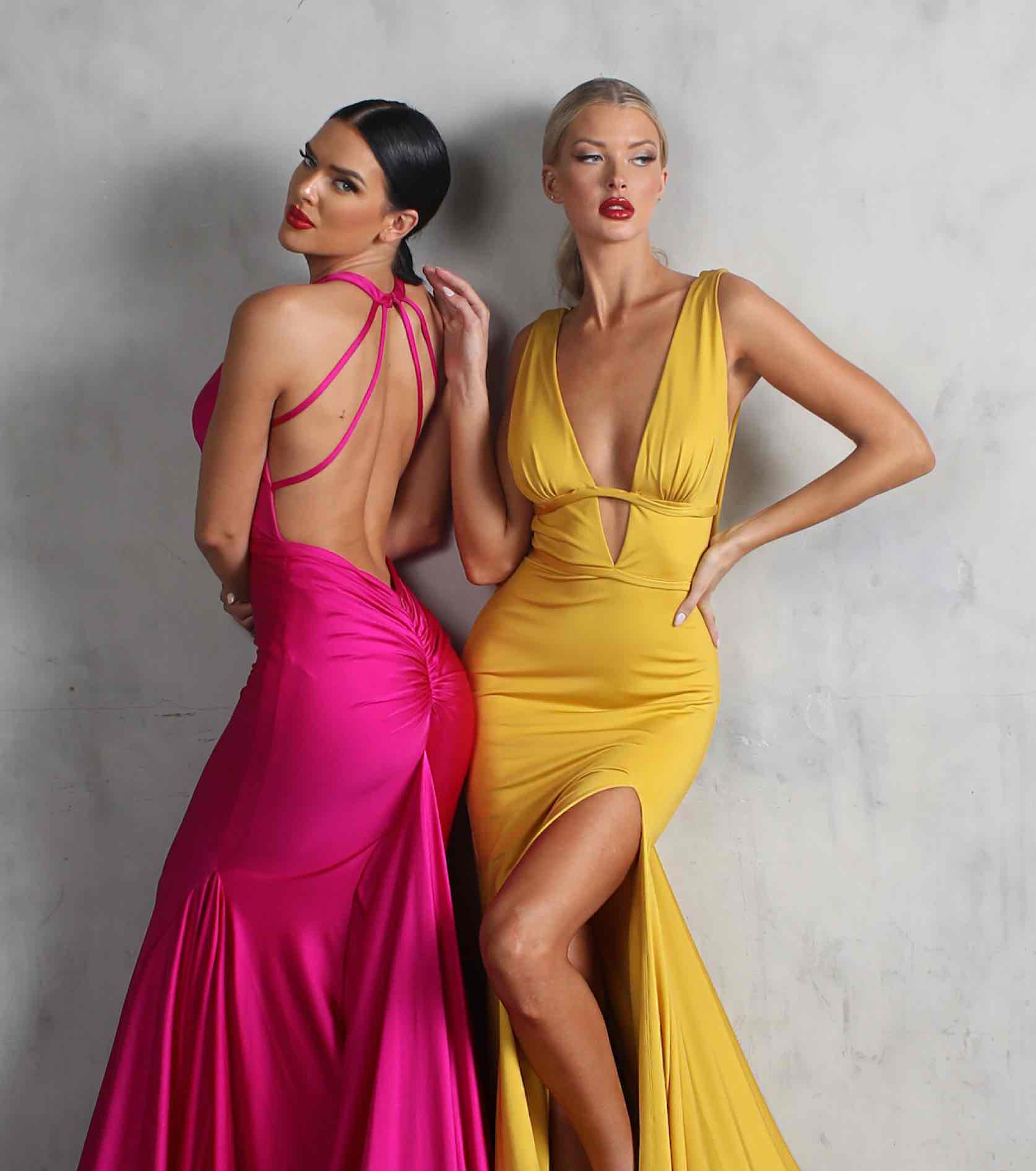 Models in pink and yellow Nicole Bakti dresses